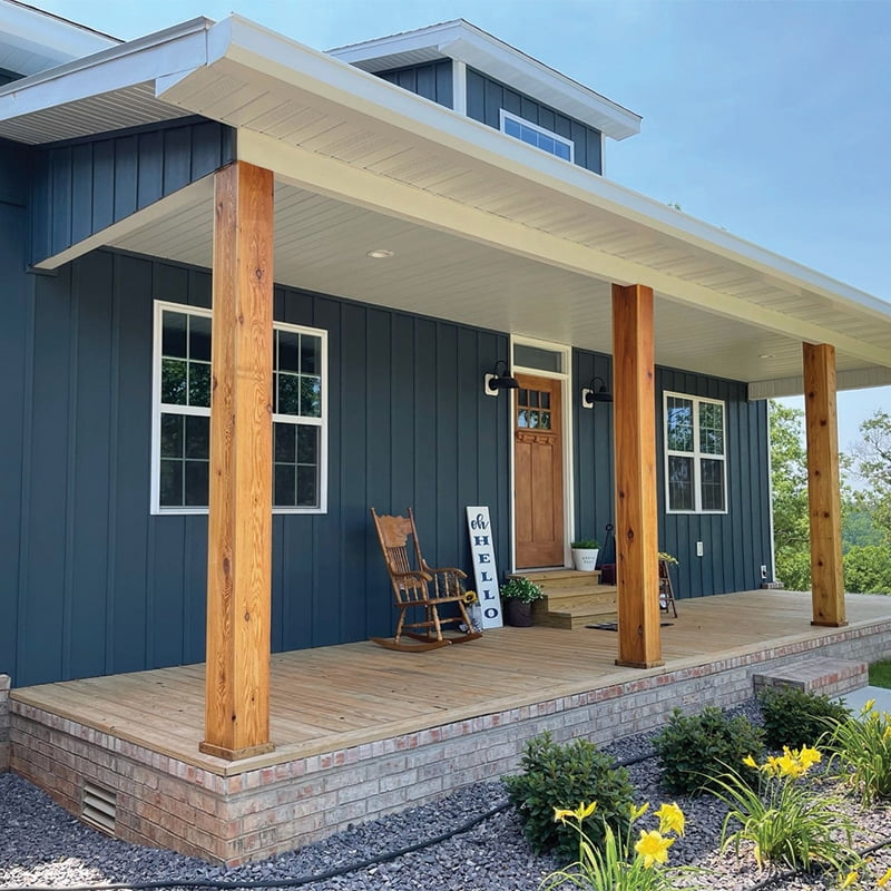 craftsman style house with blue vertical siding