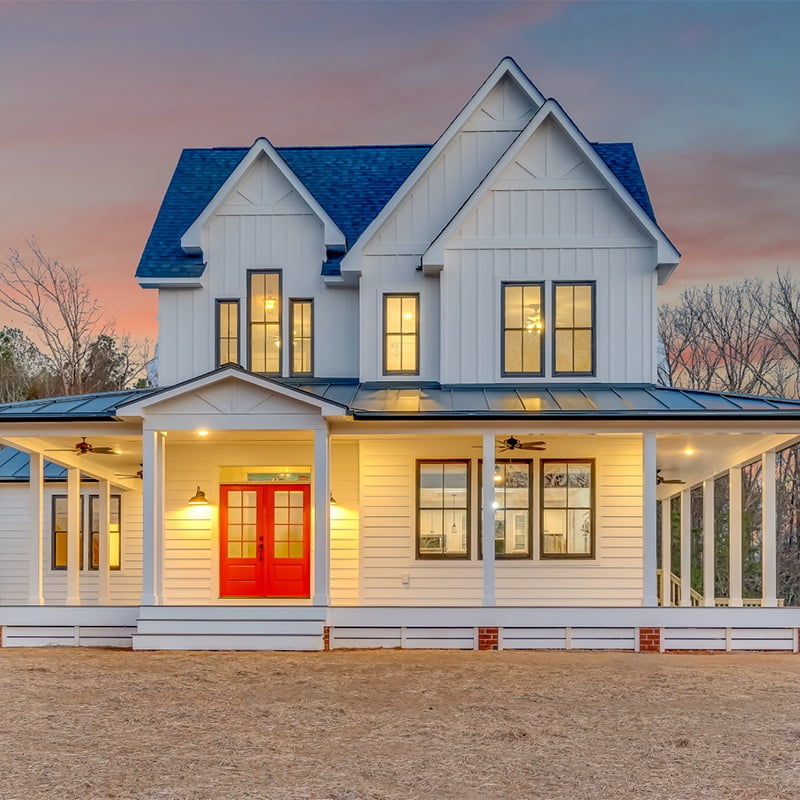 classic farmhouse with white vertical and horizontal siding