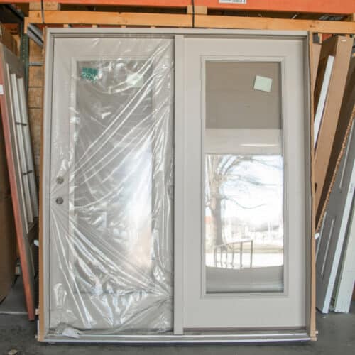 white patio doors wrapped in original plastic packaging