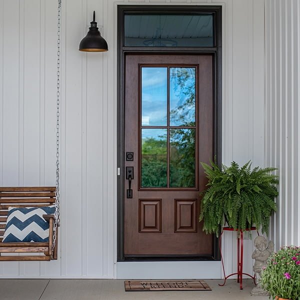 cherry stained door on front porch