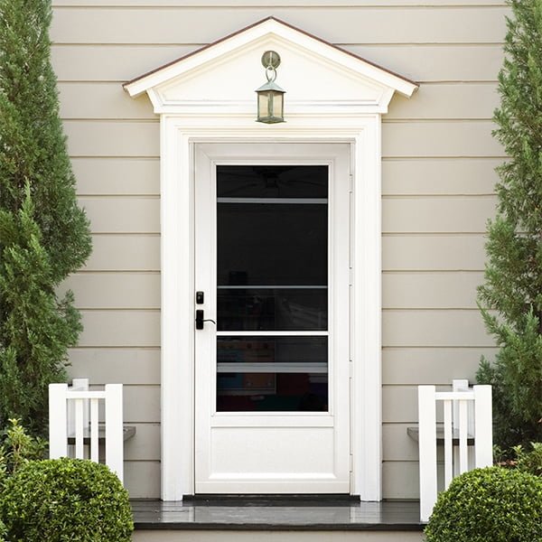 white storm door on victorian home