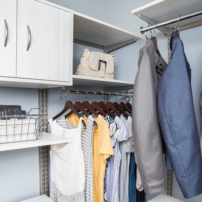 white shelving system inside closet