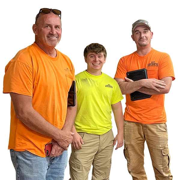 lensing-window-door-installation-team three adult males wearing work shirts and pants smiling at camera