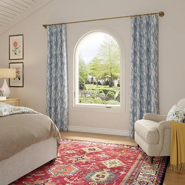white casement with round top in cozy bedroom