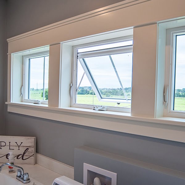 open white awning window in laundry room