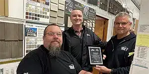 newsletter-thumbnail-2024-03 three adults posing for a photo in a lumber store