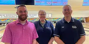 newsletter-thumbnail-2025-05 three adults standing next to each other in a bowling alley