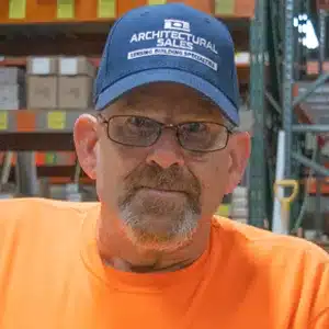 jeff-lockridge adult male with glasses, blue hat, brown and gray facial hair and orange shirt