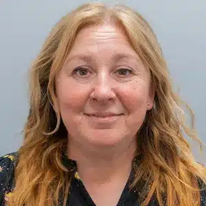 sherry-holley adult woman with light brown hair wearing a dark shirt