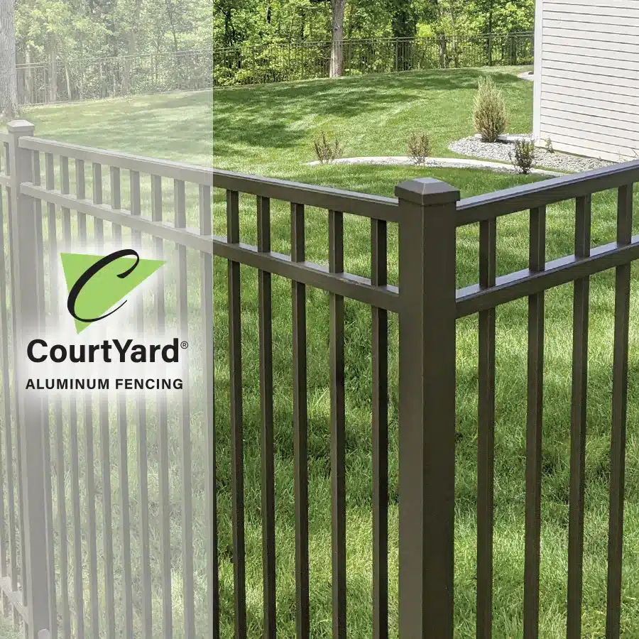 closeup of black aluminum picket fence with courtyard logo overlaying the image