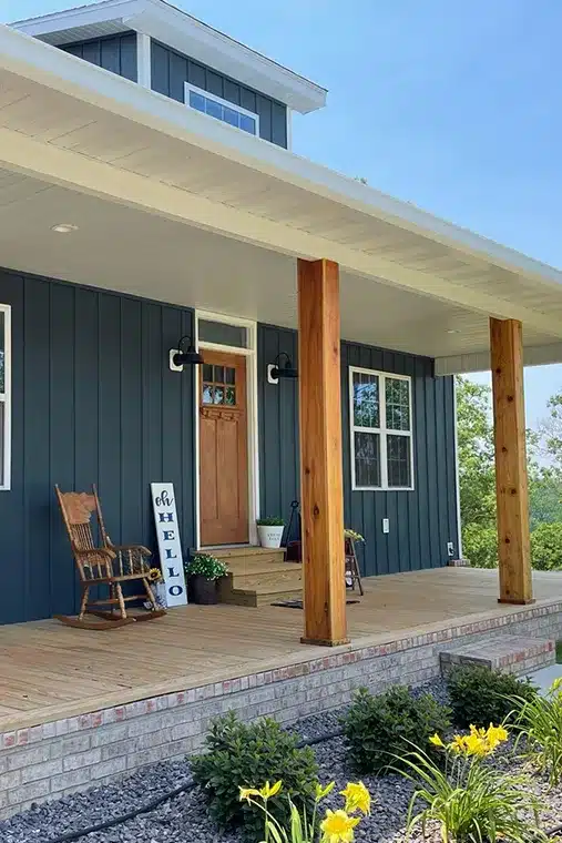 craftsman style house with blue board and batten siding